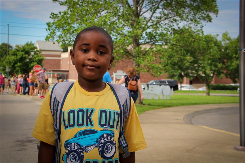 A student smiles